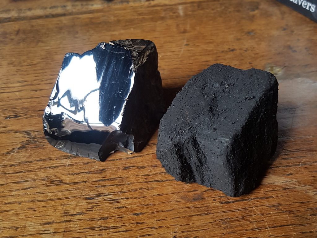 A piece of Whitby Jet and a piece of coal, the definition of Whitby jet
